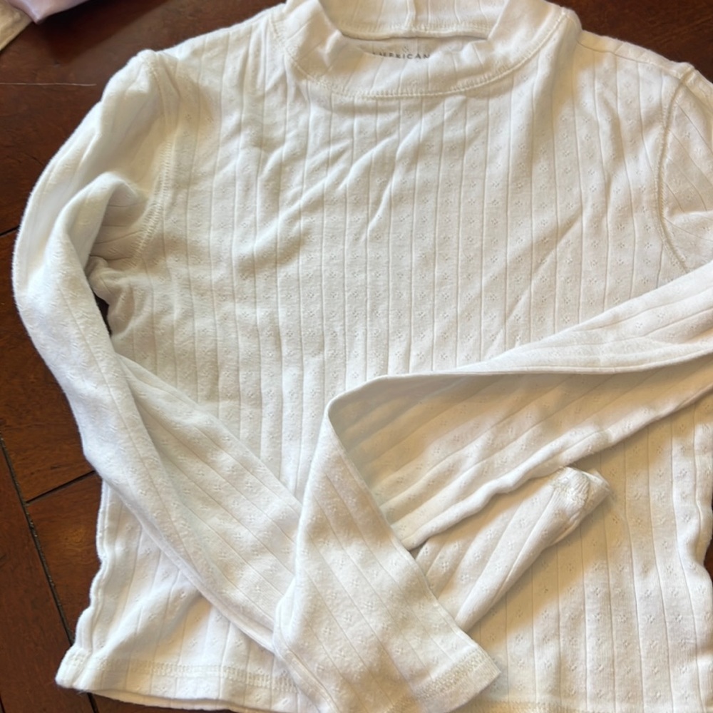 White mock neck long sleeve top